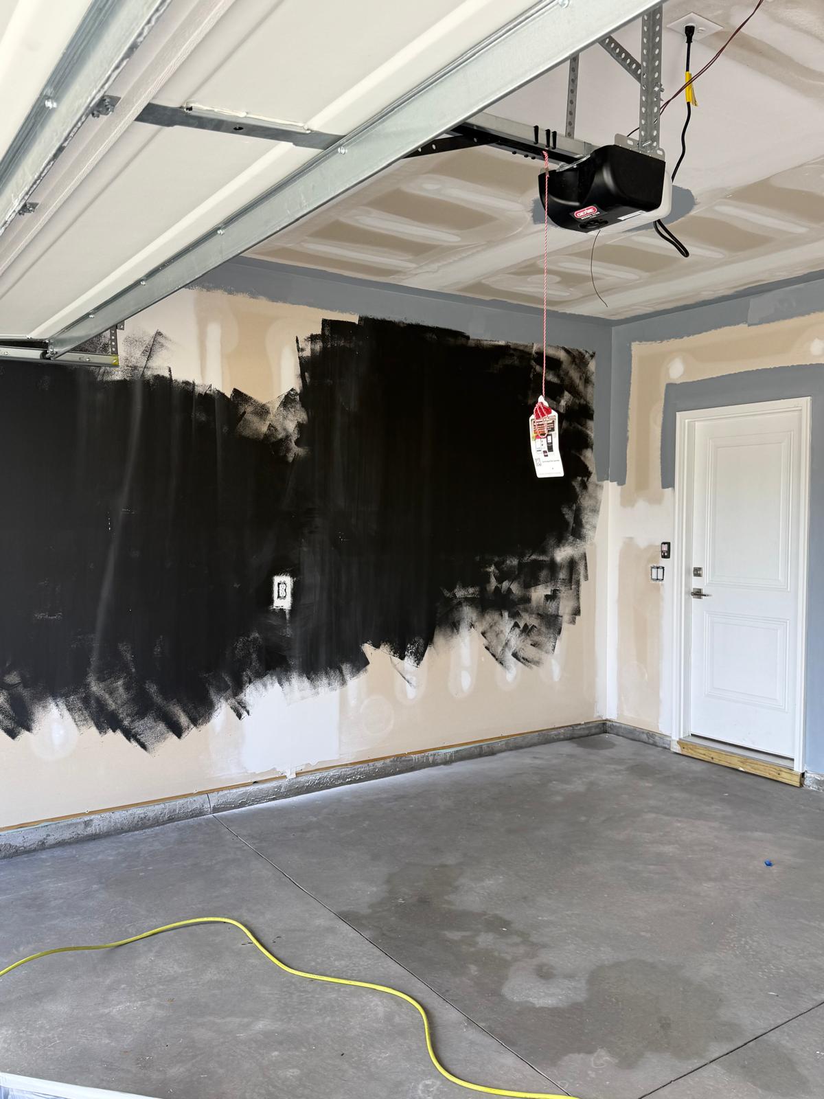 First coat of charcoal going on the garage wall